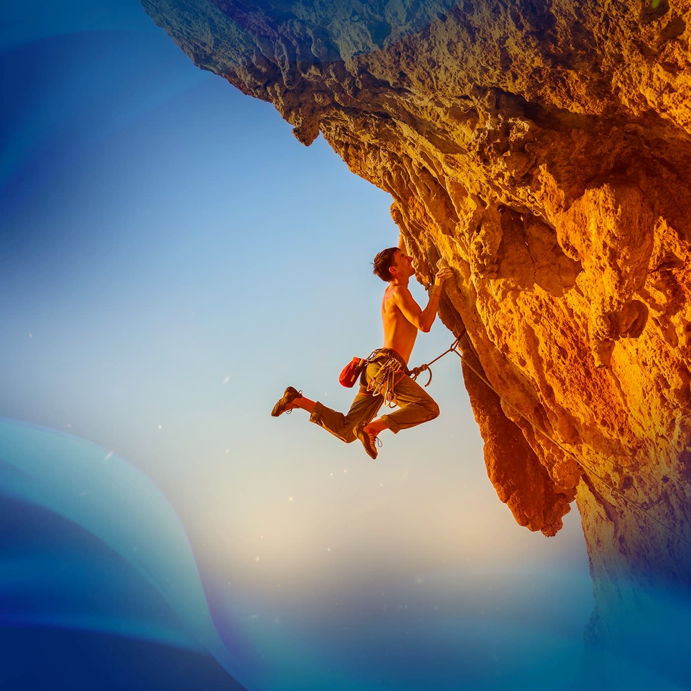 A rock climber scaling the side of a cliff