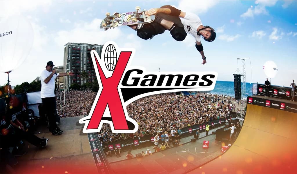 Skateboarder airborne above a large crowd at an outdoor venue with the “X Games” logo displayed.